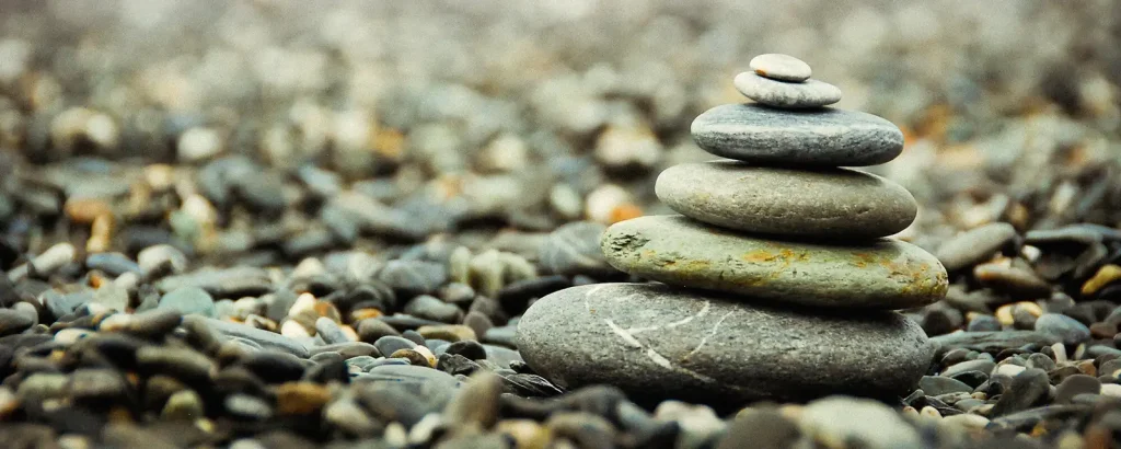 Stacked pebbles balanced on a beach