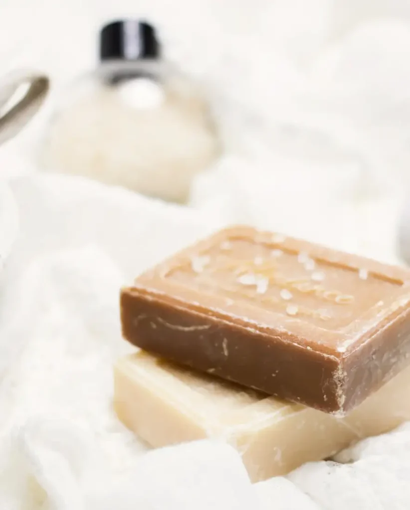 Bars of natural soap on white linen
