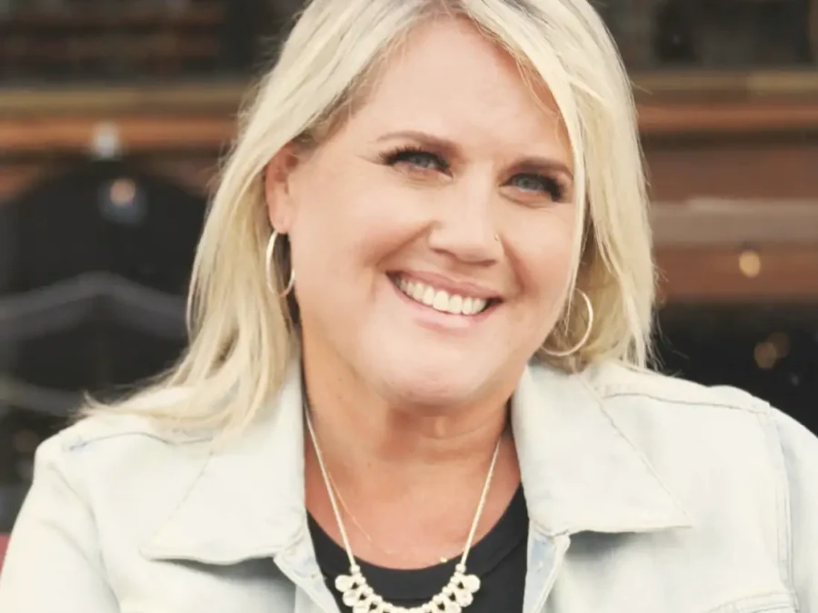 A smiling woman with blonde hair